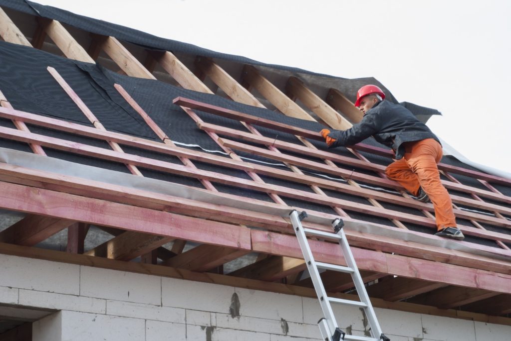 roofers fixing a roof